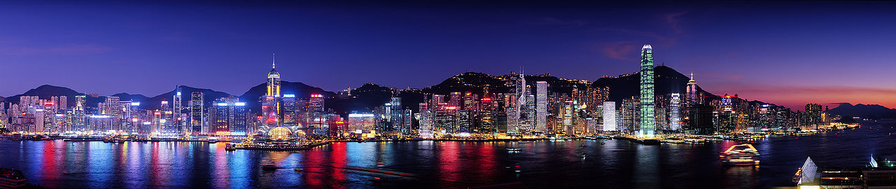 A nighttime panoramic view of Hong Kong's Vicotria Harbour skyline