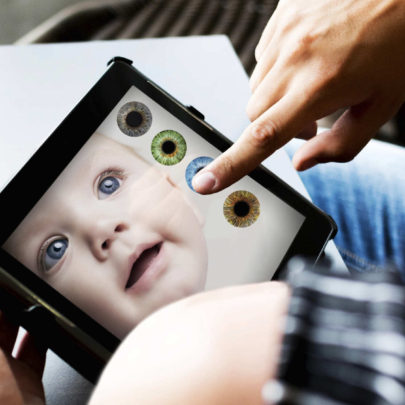 This is a simulation photo of what the future of genetic engineering could look like for humans. Here, a parent is testing different eye colours that they will choose from when selecting that trait for their "designer baby".