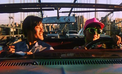 File:Zhao Nansheng riding in a car with Jane, a young runaway he meets on the streets of New York City in his search for Li Hong.jpg