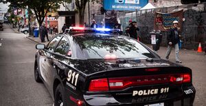 Image of a Vancouver Police Department cruiser with flashing lights