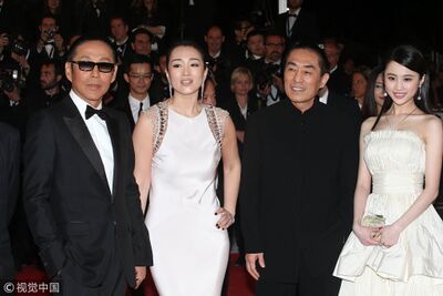 Director Zhang Yimou and the cast of film "Coming Home," Chen Daoming (L1), Gong Li (L2) and Zhang Huiwen (R) at Cannes Film Festival in 2014.
