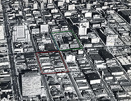 1960's aerial view of Downtown, with future site of Eaton's Centre, Pacific Centre, Robson Square and Law Courts indicated. Photo by the City of Vancouver