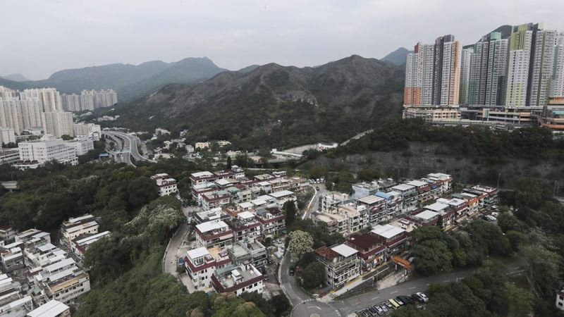 File:Development of large apartments are built next to a natural reserve site.jpg
