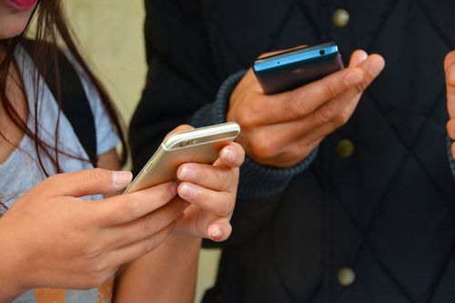 someone texting - hand on a cell phone