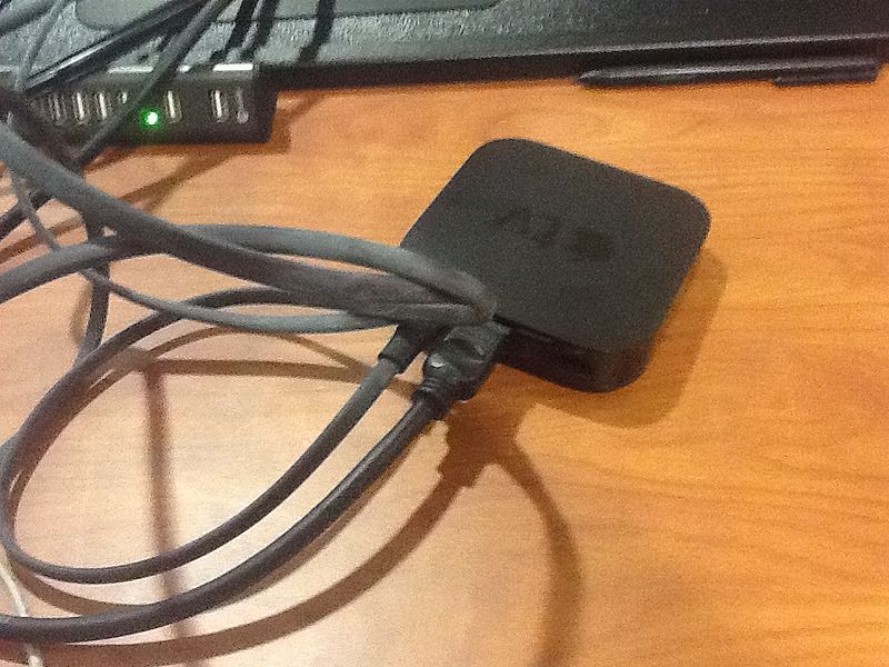 File:Plugging in the Apple TV.jpeg